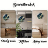 Decorative clock featuring an earth landscape design displayed in study room, kitchen, and living room settings.