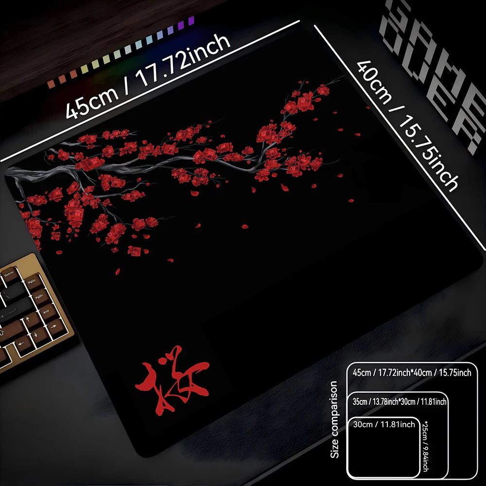 A black gaming mouse pad displaying a red cherry blossom design and size comparisons.