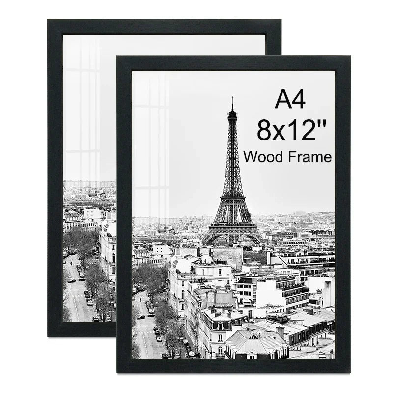 A set of two black picture frames displaying a black and white photograph of the Eiffel Tower and Paris cityscape.