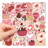 A hand holds a sheet of pink and red love-themed decorative stickers featuring hearts, cupcakes, and other sweet designs.