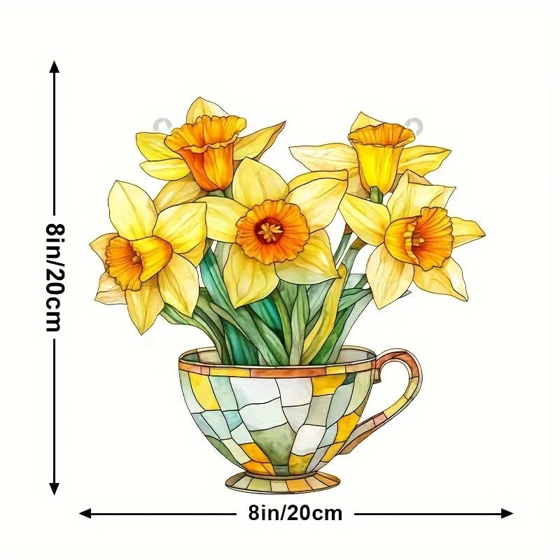 A bouquet of yellow and orange daffodils in a glazed ceramic pot.