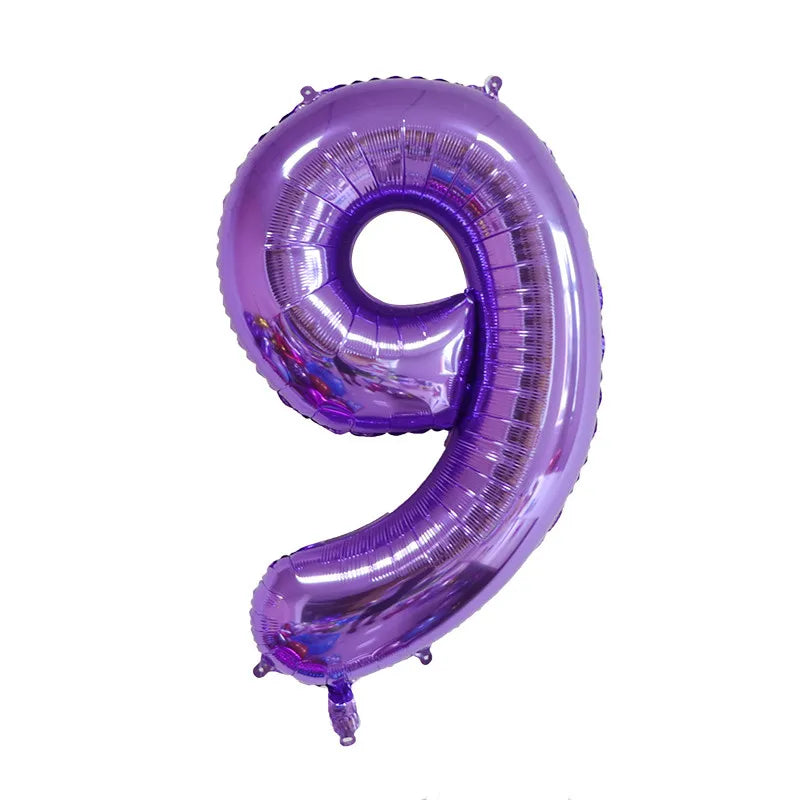 A purple foil balloon shaped like the number nine for celebrations.
