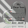 A heart-shaped acrylic keepsake plaque with engraved text about a son and mother's love.