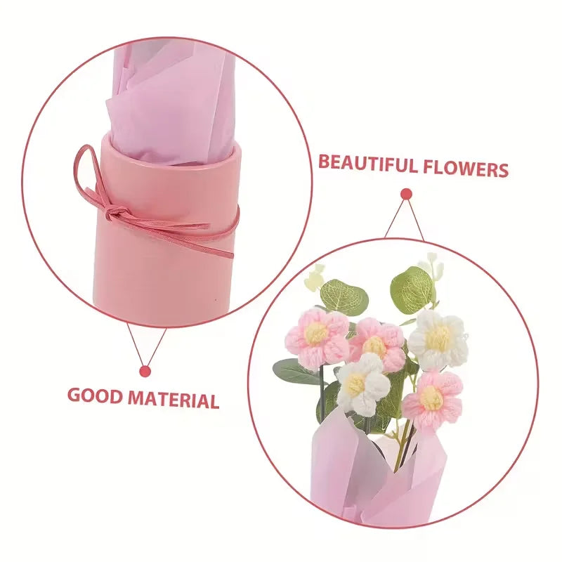 Pink handmade floral bouquet featuring white and pink flowers displayed in a pink paper wrapping.