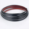 Black and red self-adhesive PVC wall trim tape rolled into a coil.
