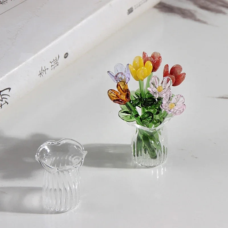 Handcrafted mini glass flower sculpture with colorful blooms in a clear glass vase