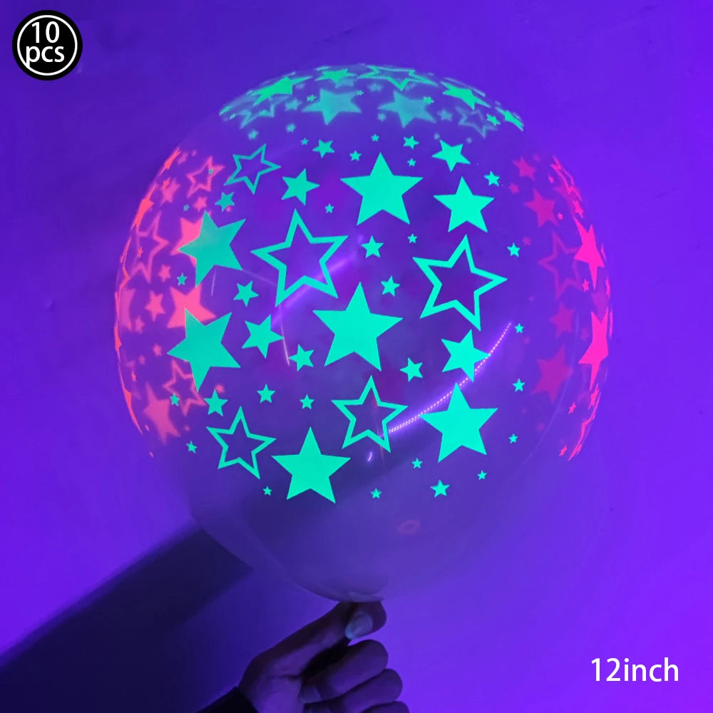 A translucent latex balloon filled with neon glow-in-the-dark stars and shapes against a purple background.