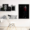 A framed canvas wall art featuring a portrait of Tiger Woods playing golf against a dark background.