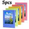 Five colorful magnetic photo frames in shades of purple, pink, yellow, and green.