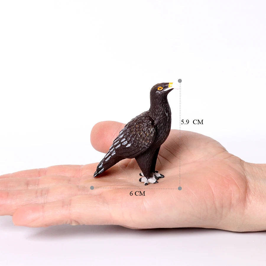 A dark brown owl figurine is shown resting on the palm of a hand, with measurements indicating its size.
