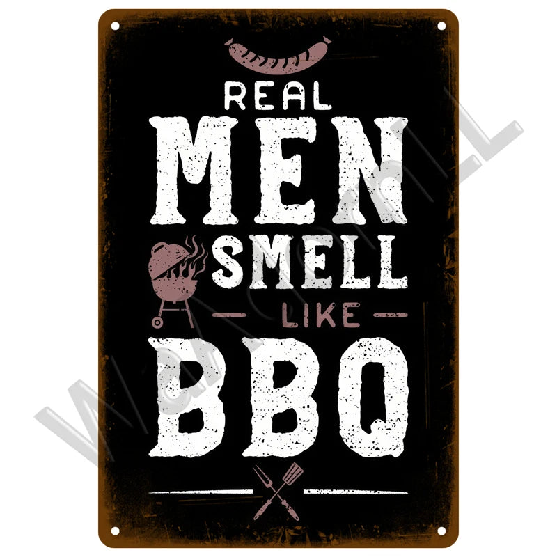 A dark metal sign with white text that reads Real Men Smell Like BBQ and features a grill icon.