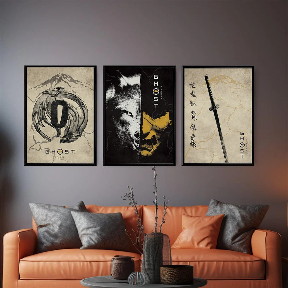 A set of three framed art prints featuring samurai themes and abstract designs displayed on a gray wall above an orange sofa.