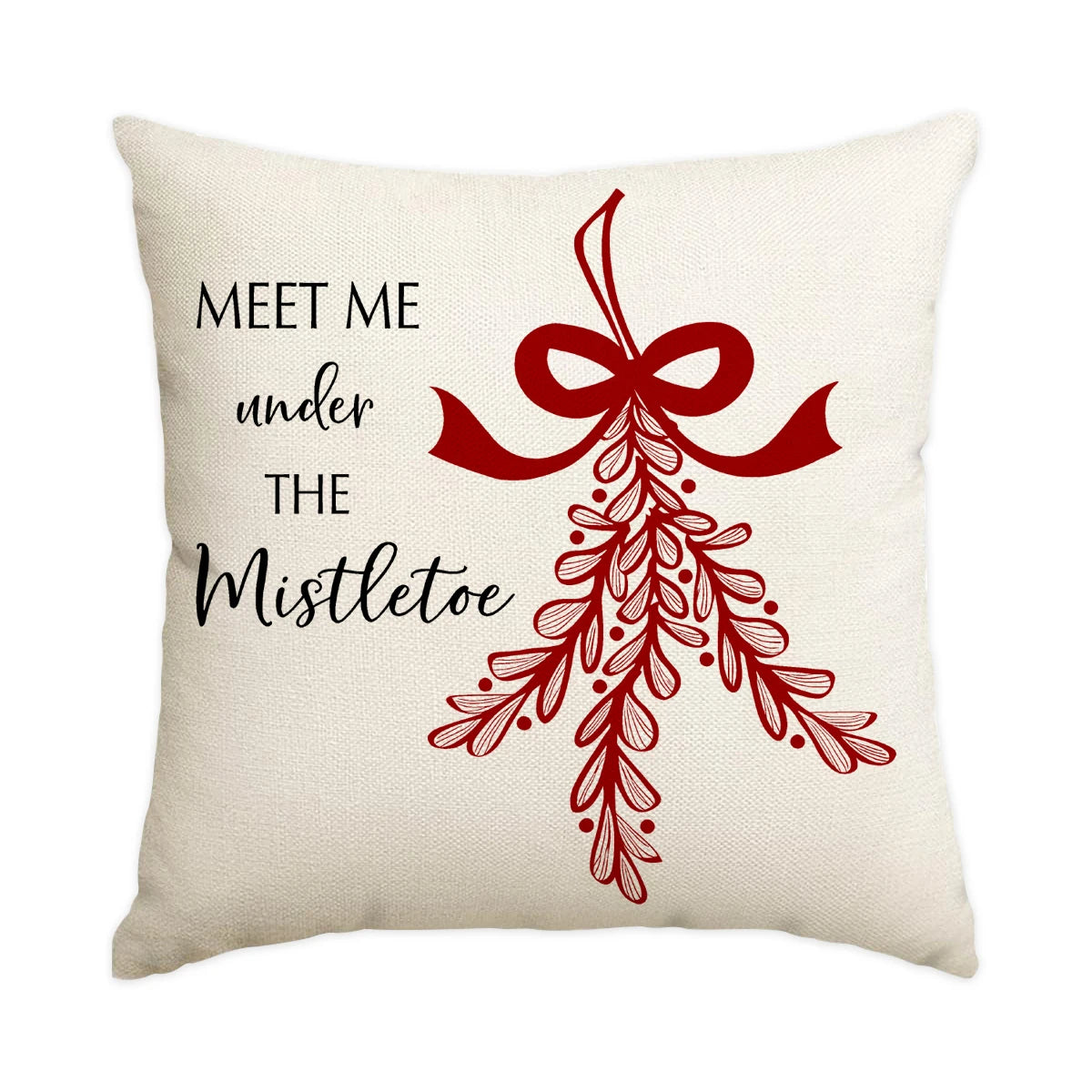 A cream-colored cushion cover featuring a red bow and mistletoe wreath design.