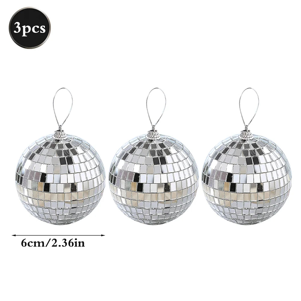Three silver disco mirror balls with hanging loops for parties and decor
