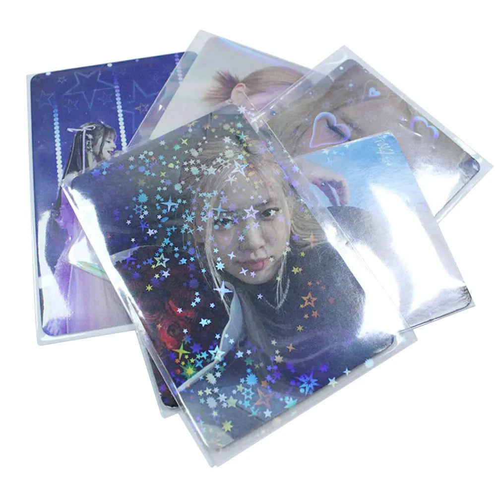 A stack of holographic card sleeves featuring a portrait of a woman with sparkling stars and light effects.