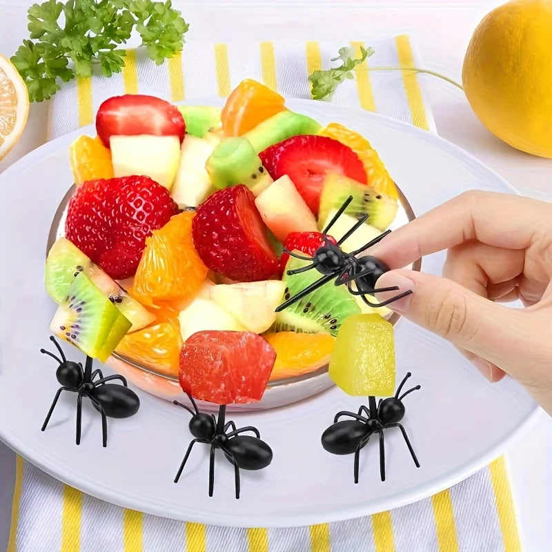 Reusable ant-shaped plastic toothpicks and fruit forks used for serving party snacks like fruit