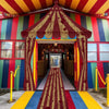 A colorful door arch banner decorated with a circus theme featuring red and gold accents.