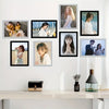 A set of five black and white photo frames displaying various portraits of women and men.