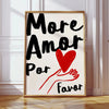A framed canvas print featuring the text More Amor Por Favor written in black and red on a white background.
