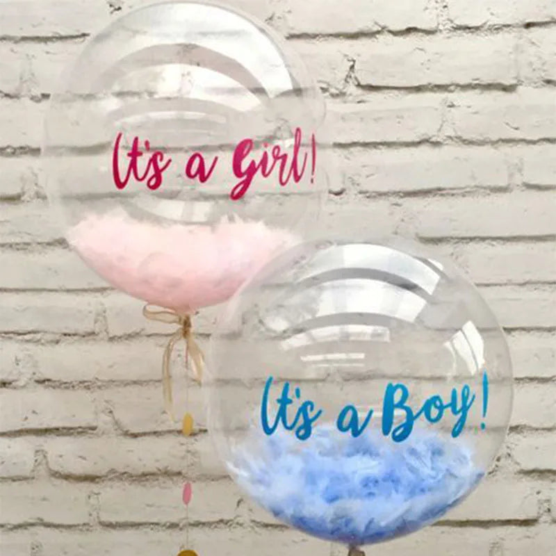 Two clear balloons filled with pink and blue fluffy material, labeled It's a Girl and It's a Boy