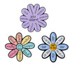 A set of enamel pins featuring a daisy flower design with various positive affirmations like love kindness patience empathy c