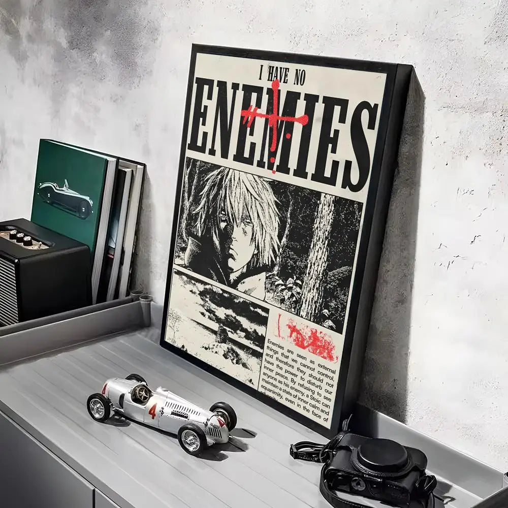 A framed poster featuring a dark, intense image of a character from Vinland Saga anime, displayed on a gray shelf.