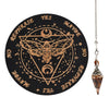 A black wooden pendulum board featuring a geometric design and an inlaid rose quartz crystal necklace on a silver chain.