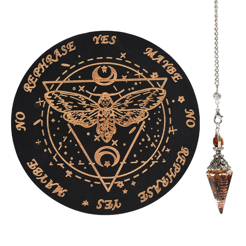 A black wooden pendulum board featuring a geometric design and an inlaid rose quartz crystal necklace on a silver chain.