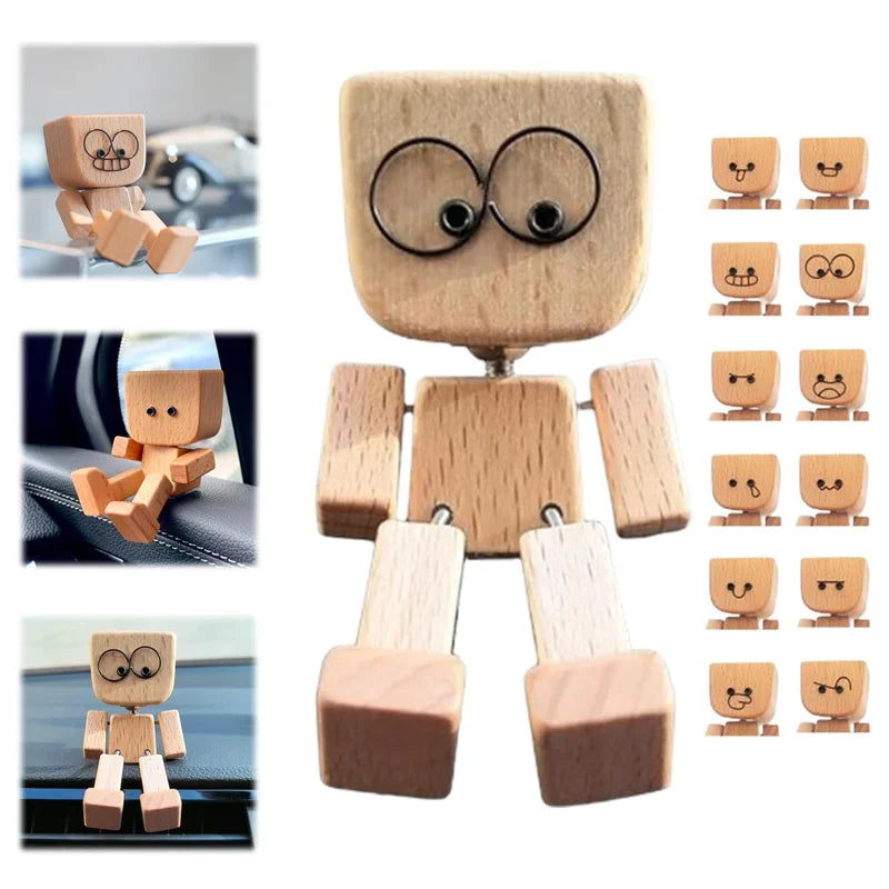 A set of wooden figurines depicting a man with large eyes, used for fun car and desk decoration.