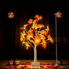 An LED maple leaf tree lamp with warm glow displayed against a dark background.