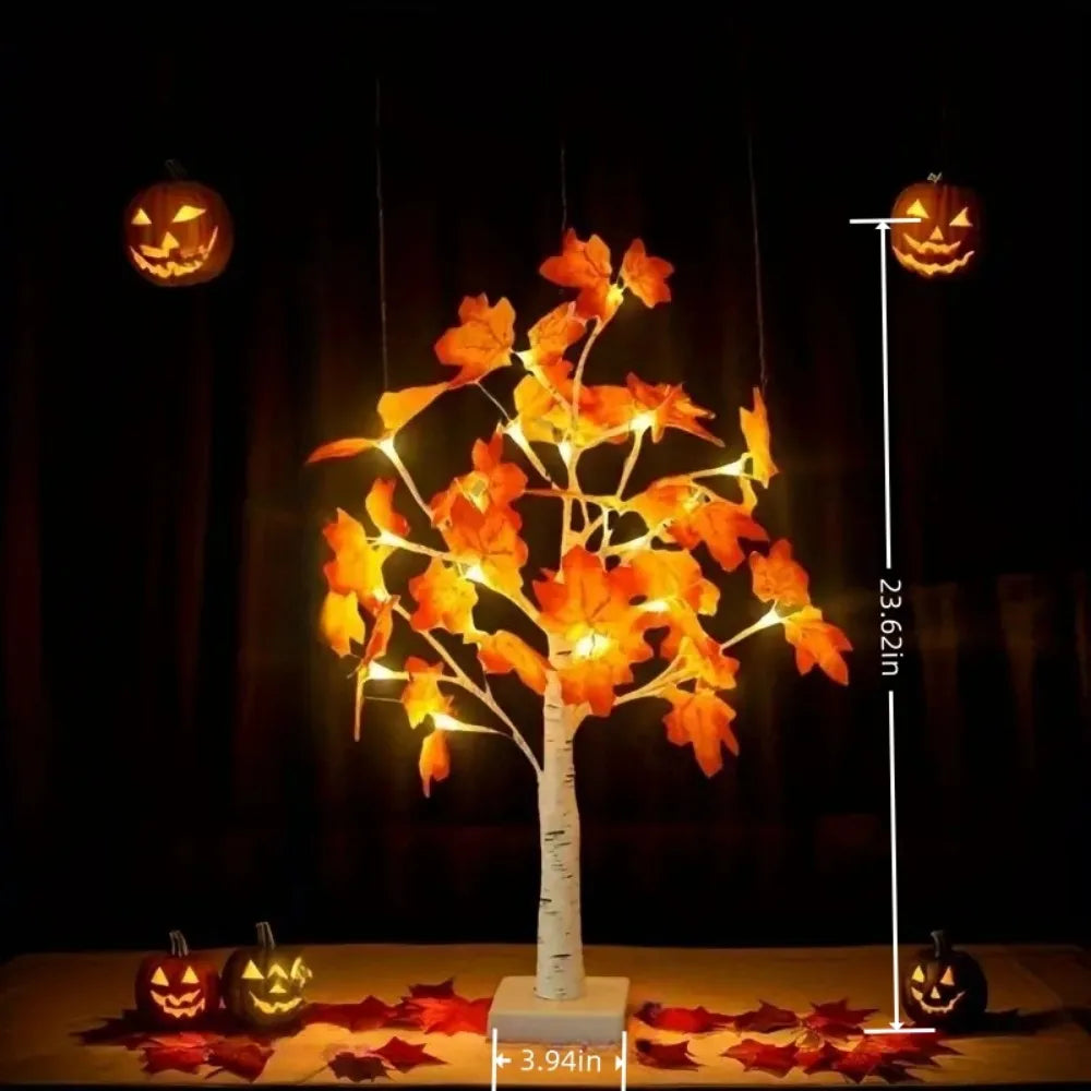 An LED maple leaf tree lamp with warm glow displayed against a dark background.
