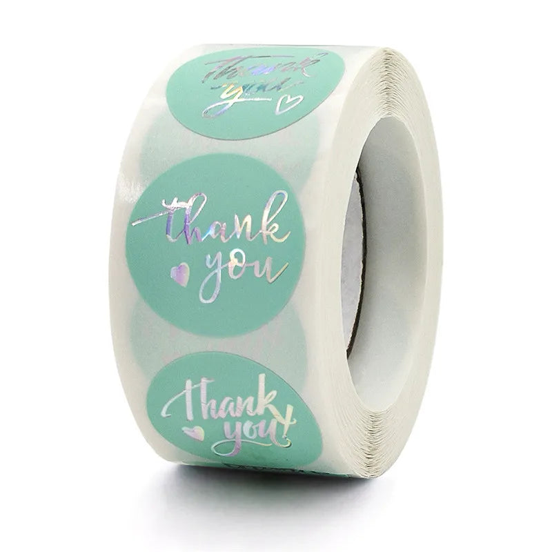 Roll of heart shaped thank you stickers in light green packaging