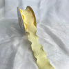 Yellow decorative fishtail yarn ribbon displayed against a white background.