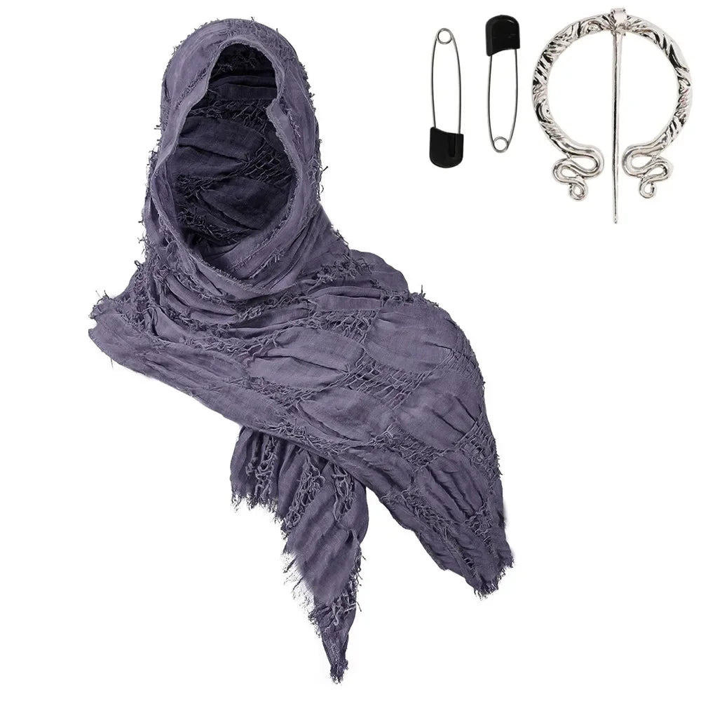 A purple hooded cloak with frayed edges and a silver Viking brooch displayed next to the garment.