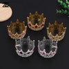 A set of four decorative crown toppers and hair accessories featuring gold, silver, and rose gold finishes with pink and red 