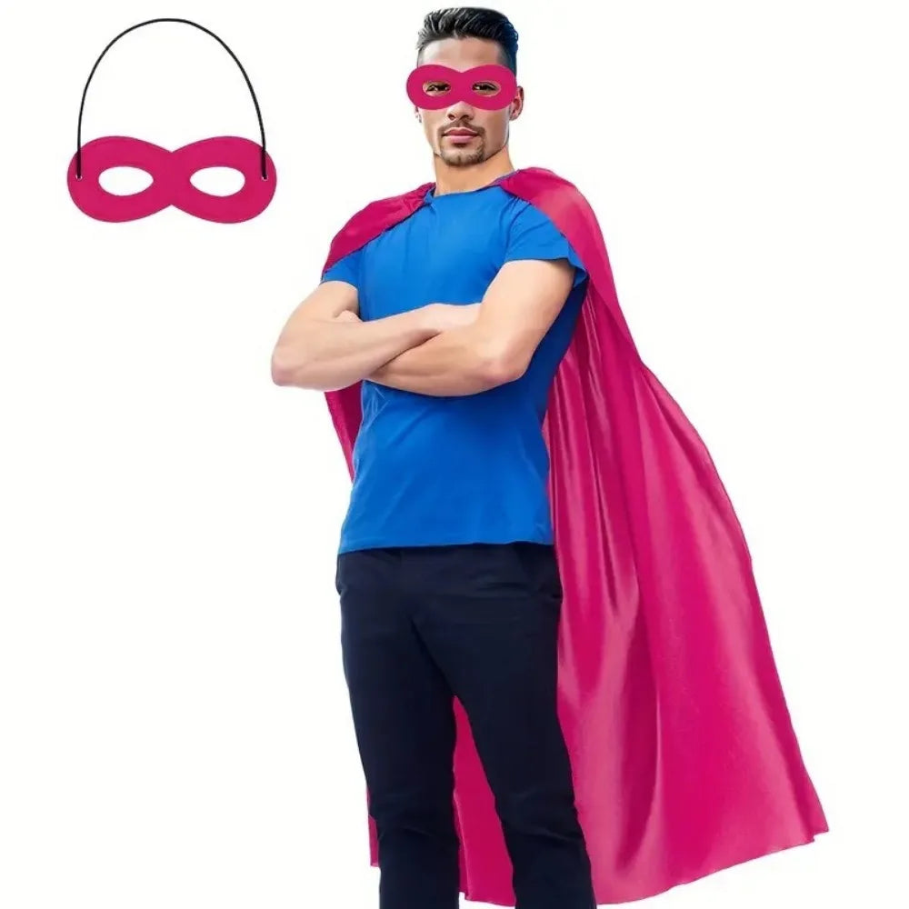 Adult superhero costume set featuring a pink eye mask and a bright blue shirt with a flowing pink cape.