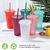 A collection of colorful glitter party cups with lids and straws displayed on a white surface.