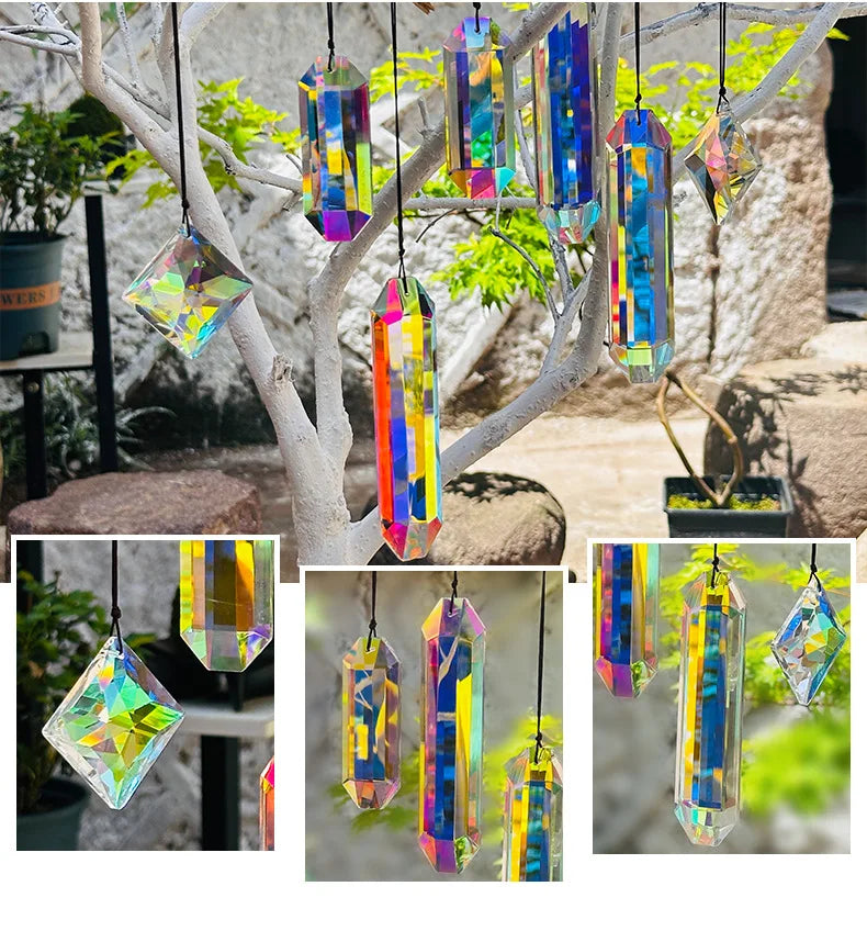 A set of seven crystal prism sun catchers hanging from a tree branch against a blurred green background.