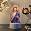 A ceramic illuminated night light depicting Jesus Christ with a beard and halo, set on a white base.