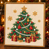 A framed diamond painting depicting a festive Christmas tree adorned with red and green gems and gold accents.