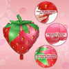 A set of six red strawberry foil balloons with green leaves, showing how to press the seal and highlighting the clear printin