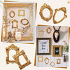 A collection of vintage gold DIY shadow box frames and decorative gold frames displayed on a white wooden background.