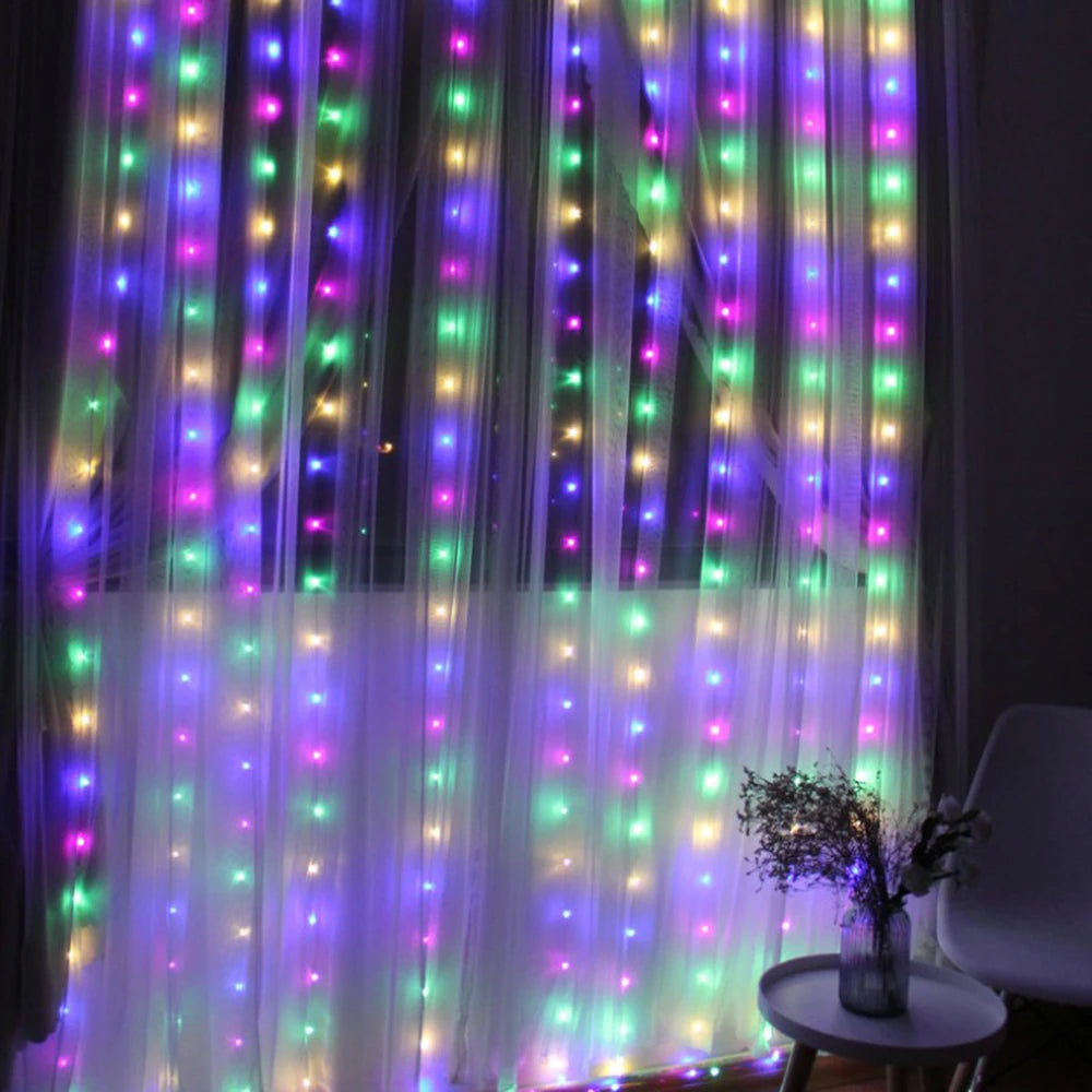 Purple and green LED curtain fairy lights illuminating a sheer fabric backdrop.