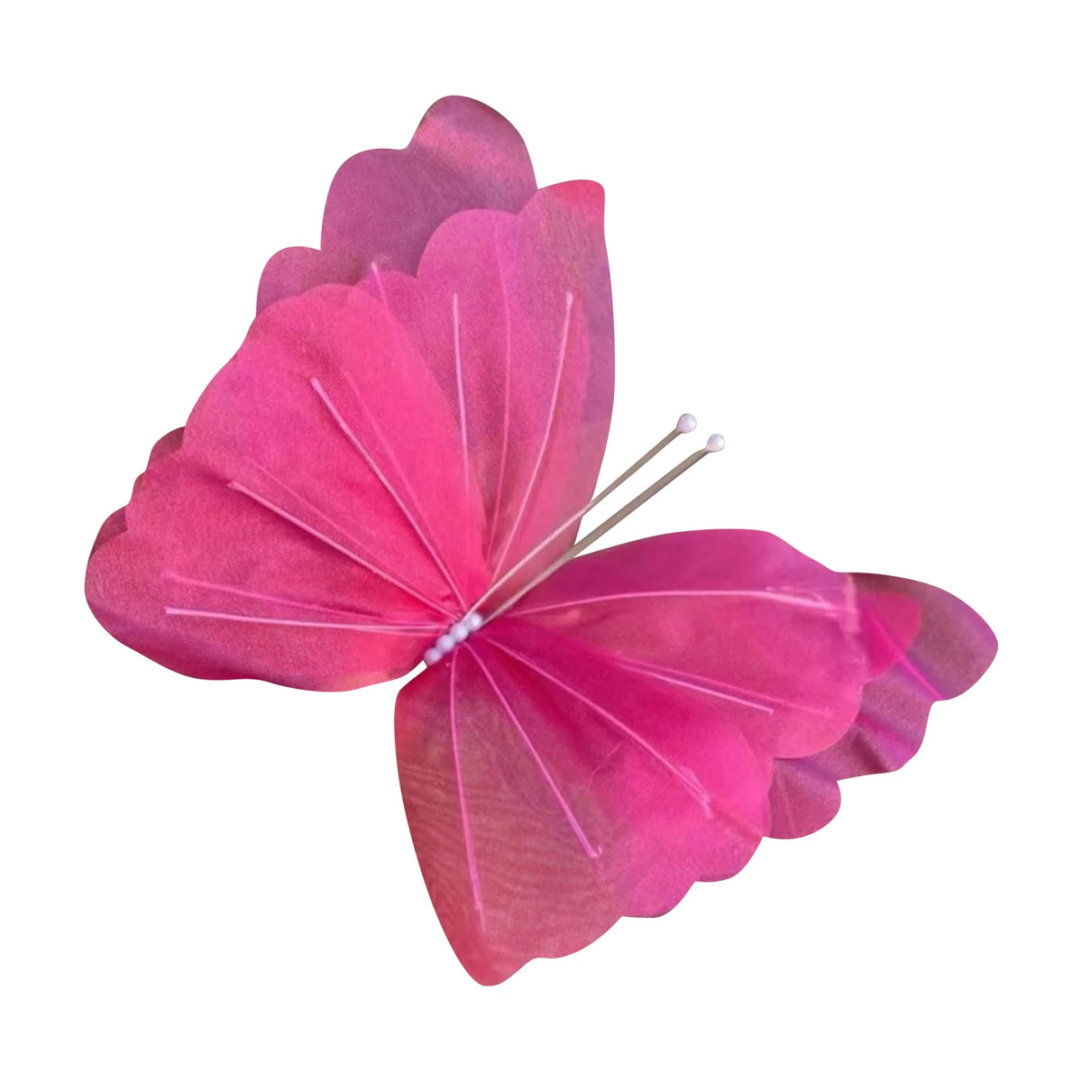 A vibrant pink butterfly with delicate veining, used as wall decor.