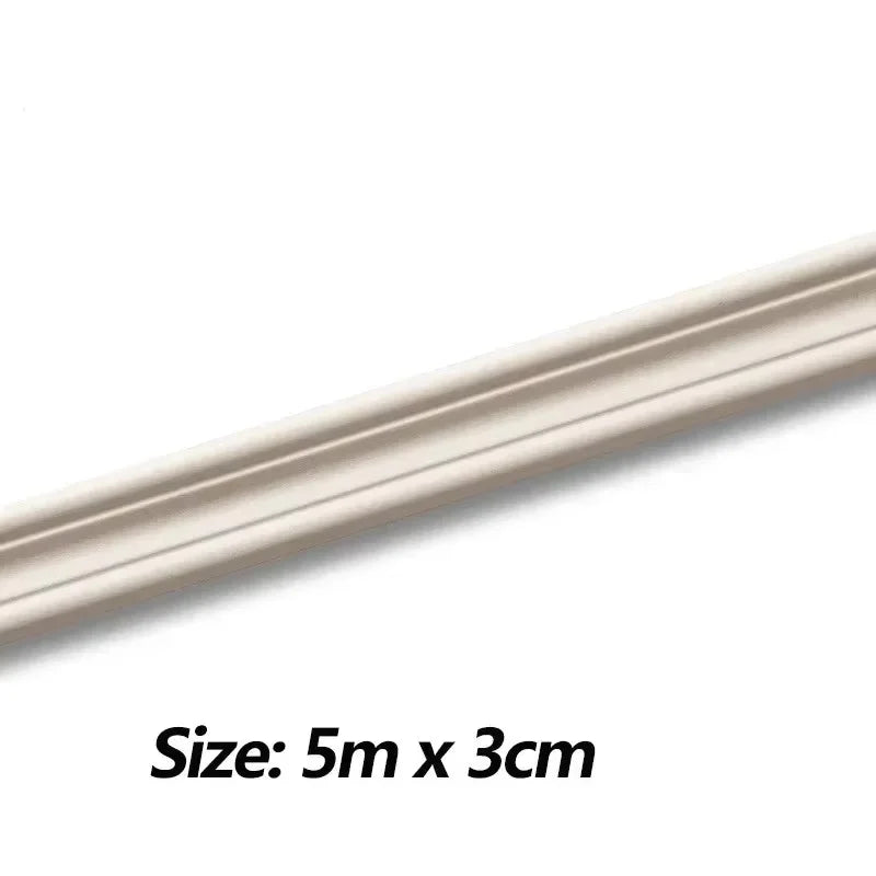 A long, light beige self-adhesive flexible wall skirting strip measuring 5 meters by 3 centimeters.