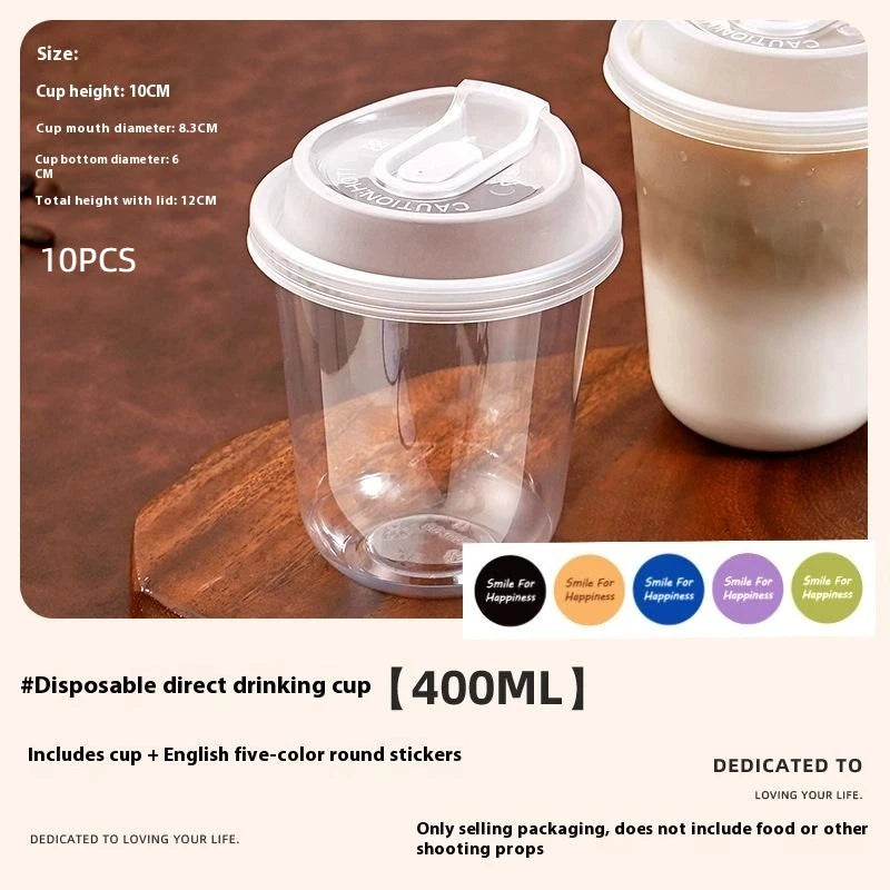 A set of ten clear disposable coffee cups with lids is shown on a wooden surface.