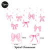 Seven pieces of glitter pink spiral ornament bows for a birthday banner