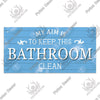 A light blue wooden sign with white text that reads My aim is to keep this bathroom clean.