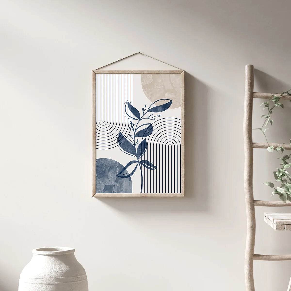 Three abstract geometric wall art prints featuring botanical line drawings in blue and beige tones.