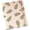 A beige linen photo album with a patterned cover featuring green leaves.